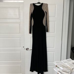 form fitting formal gown size4 with mesh studded sleeves and sides. Black